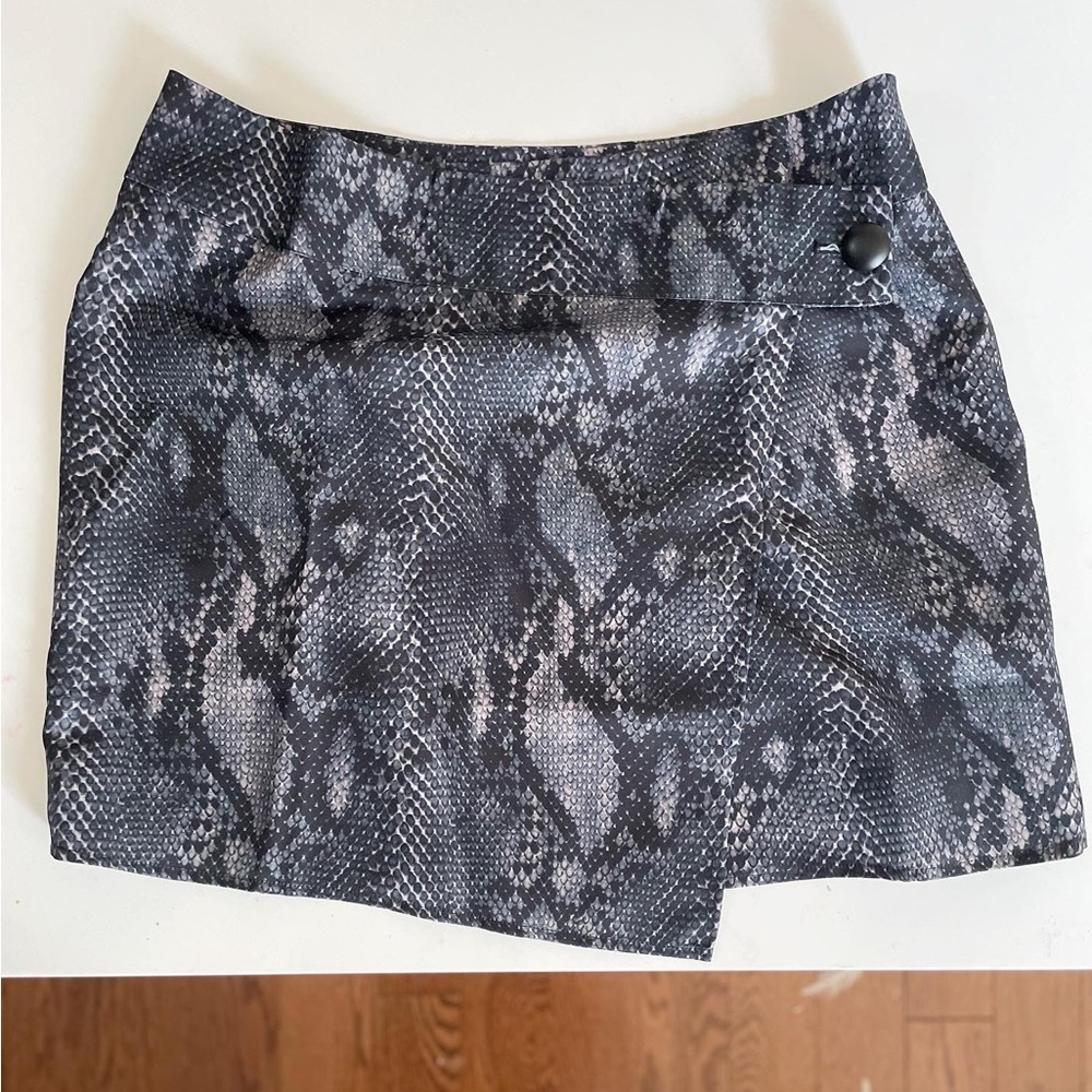 Brand new with tags snake print skirt with slit!